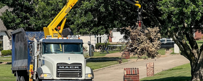 Waste Connections truck picking up bulky brush.